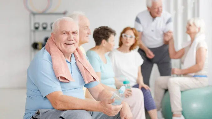 Participant balancing on shoreline rocks